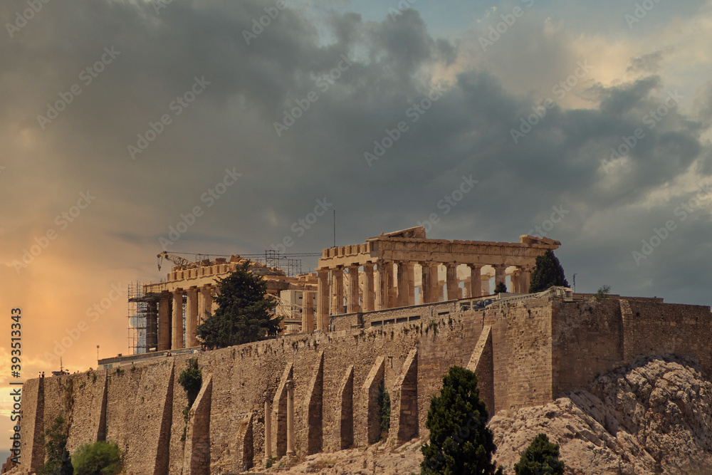 scenic view of Parthenon temple on Acropolis hill and cloudy sky sunset, Athens, Greece