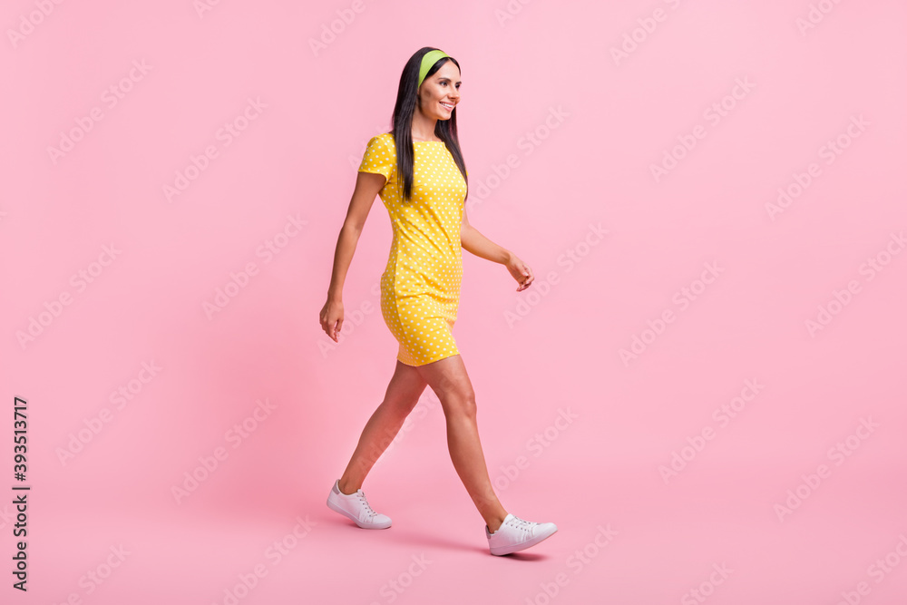 Full size portrait of walking person look empty space white shoes vintage outfit isolated on pink color background Full size portrait of walking person look empty space white shoes vintage outfit isolated on pink color background