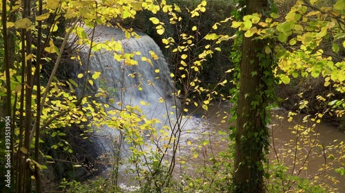 Trull waterfall in the fall/autumn, man made water fall in Taunton Somerset. photo