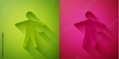 Paper cut Bungee jumping icon isolated on green and pink background. Paper art style. Vector Illustration.