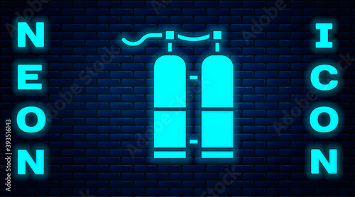 Glowing neon Aqualung icon isolated on brick wall background. Oxygen tank for diver. Diving equipment. Extreme sport. Sport equipment. Vector Illustration.