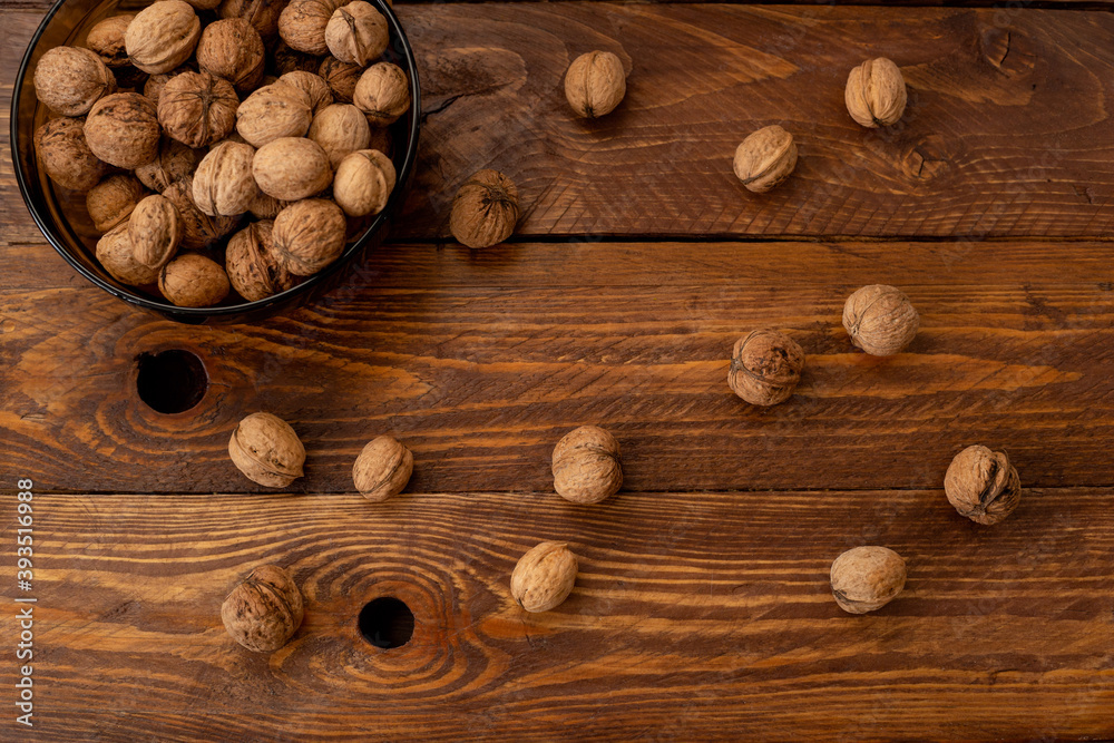 walnuts on wooden background walnuts on wooden background