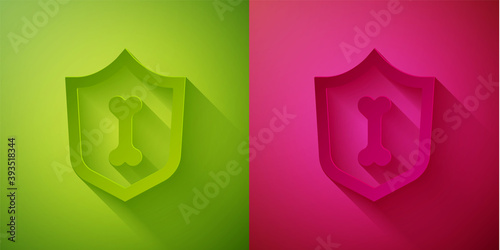 Paper cut Animal health insurance icon isolated on green and pink background. Pet protection concept. Paper art style. Vector.