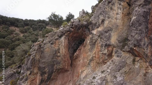 Wallpaper Mural Going over the top of a sharp mountain sliver. Cloudy gloomy skies. Mixed climbing area in Andalusia, Spain Torontodigital.ca
