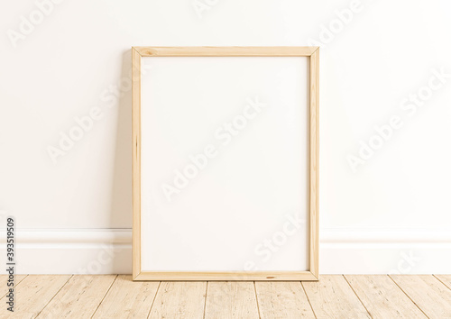 Vertical 8x10 Wood Frame Mockup. Vertical Wood Frame on a wooden floor and white wall.
