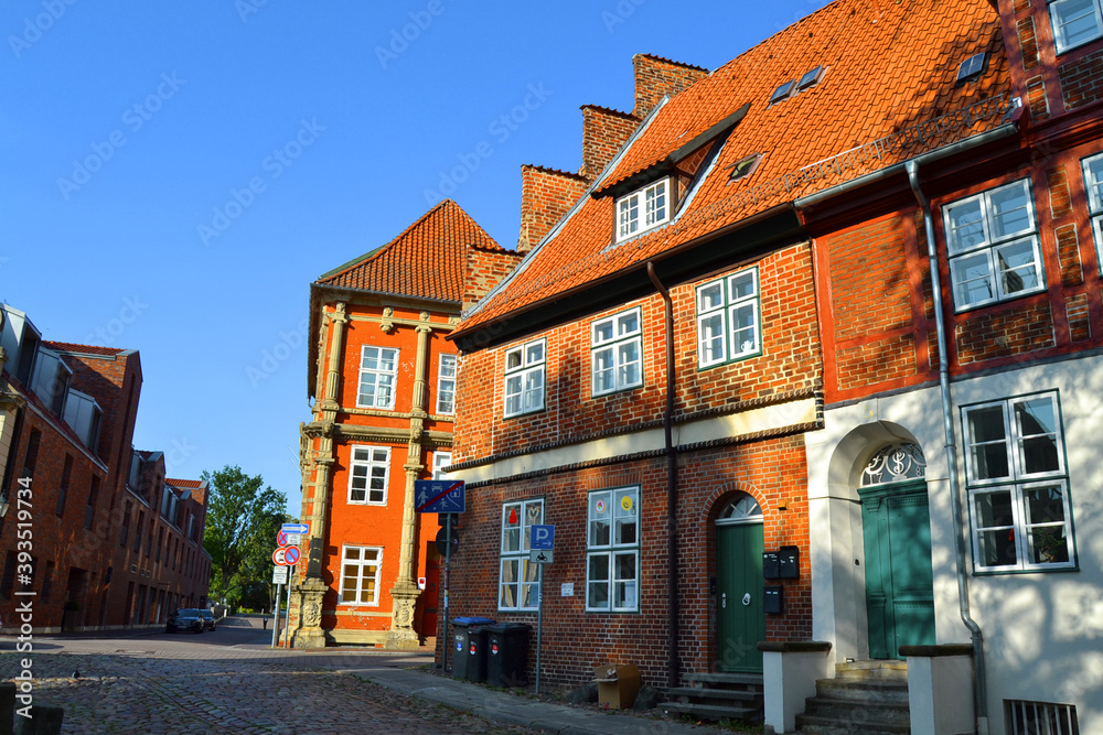 Empty street with old brick buildings, Luneburg city, Germany. 