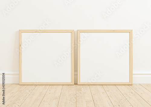 Double 8x8 Square Wooden Frame mockup on wooden marble and white wall. Two empty poster frame mockup on wooden floor and white background. 3D Rendering