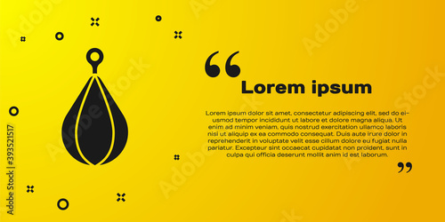 Black Punching bag icon isolated on yellow background. Vector.