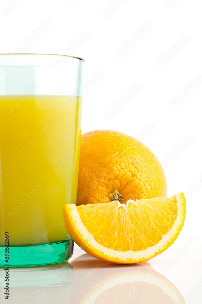 Glass of fresh orange juice with sliced oranges on white background. Glass of fresh orange juice with sliced oranges on white background.