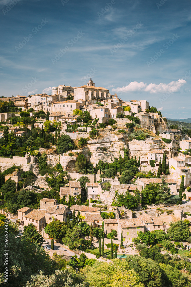 Gordes, Provence, France. Beautiful Scenic View Of Medieval Hilltop Village Of Gordes. Sunny Summer Sky. Famous Landmark.