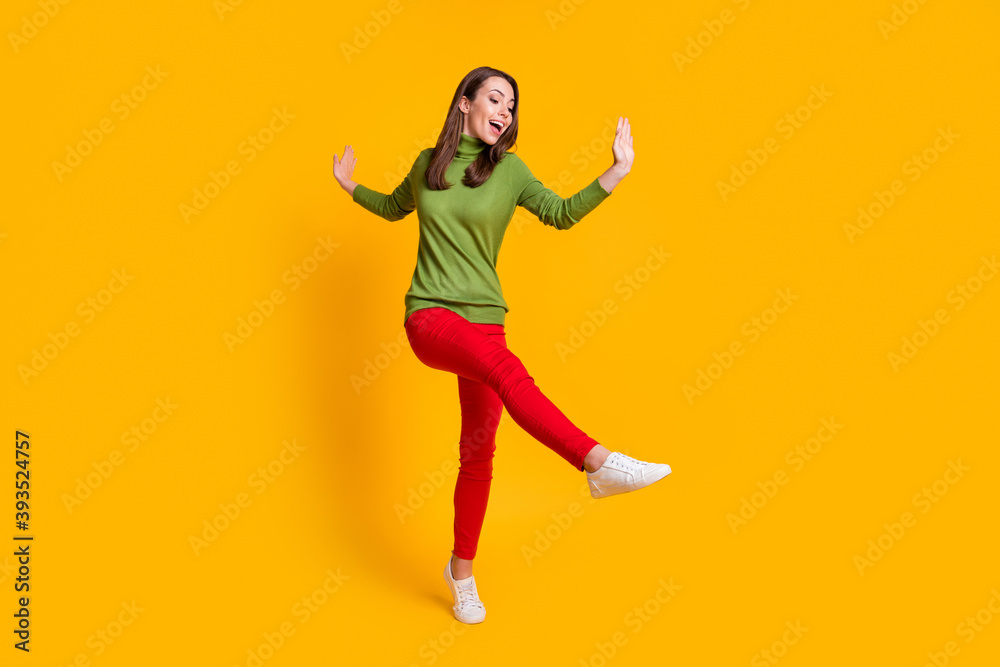Full length body size view of pretty skinny cheerful girl jumping dancing having fun clubbing isolated shine yellow color background