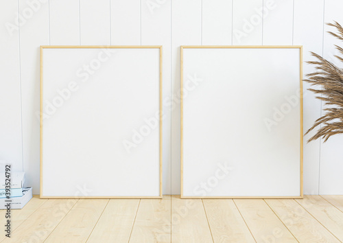 Double 8x10 Vertical Wooden Frame mockup on wooden marble and pink wallpaper wall. Two empty poster frame mockup with decorations on wooden floor and wooden background. 3D Rendering