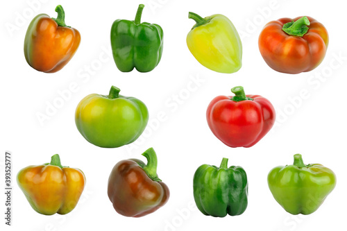 Colored raw bell peppers, white background