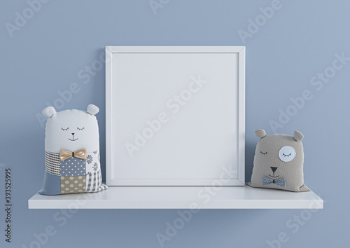 Single square white frame mockup for nursery or kids room on white shelf with toys. Children room nursery mockup frame poster on clean blue wall.