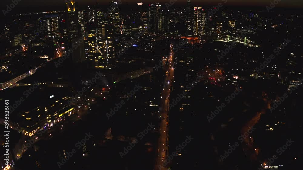 Beautiful wide intro Shot of Frankfurt, Germany Skyline at Night with Skyscraper lights and lit up streets Beautiful wide intro Shot of Frankfurt, Germany Skyline at Night with Skyscraper lights and lit up streets