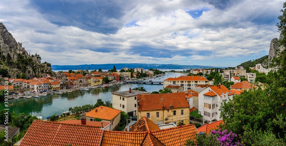 Panoramic landscape of Omis city on a cloudy day.