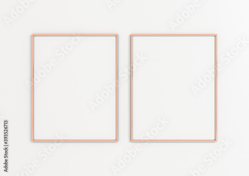 Two Vertical 8x10 Rose Gold Frames Mockup. Double Vertical Rose Gold Frames on a white wall.