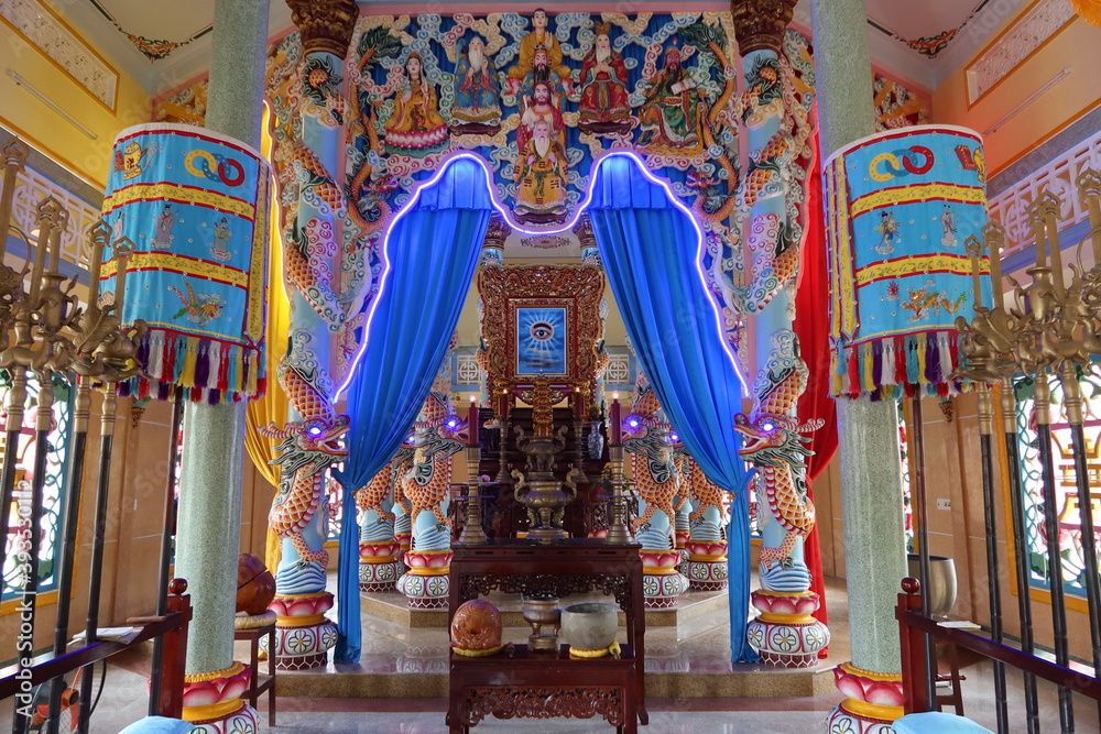 Hoi An, Vietnam, November 19, 2020: Altar in the main hall of worship of the Cao Dai temple in Hoi An