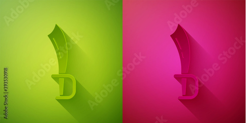 Paper cut Pirate sword icon isolated on green and pink background. Sabre sign. Paper art style. Vector.