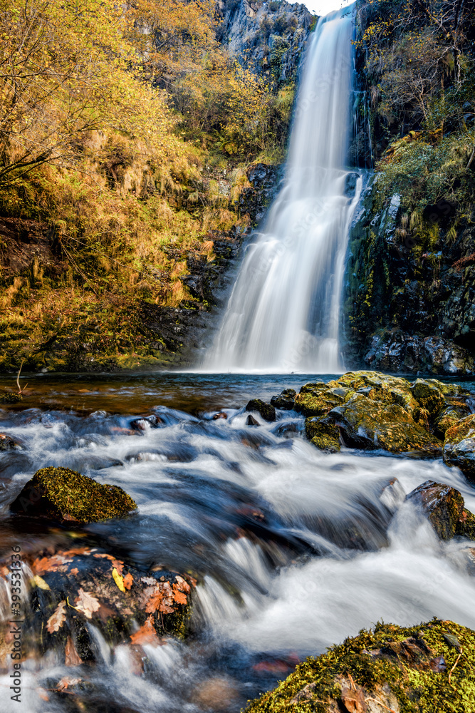 view of the Cascada de Cioyo waterfalls in Asturias in late autumn view of the Cascada de Cioyo waterfalls in Asturias in late autumn