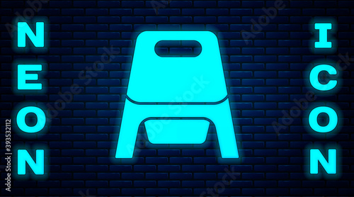 Glowing neon Baby potty icon isolated on brick wall background. Chamber pot. Vector.