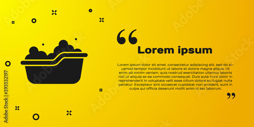 Black Baby bathtub with foam bubbles inside icon isolated on yellow background. Vector.