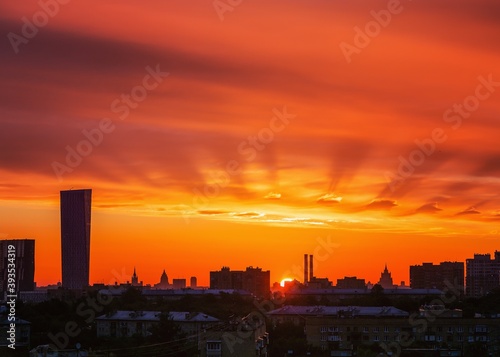 Beautiful bright sunset with cloudscape and multicolored evening glowing over skyline. Moscow, Russia.