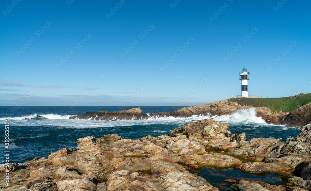 view of the lighthouse on Isla Pancha in Galicia