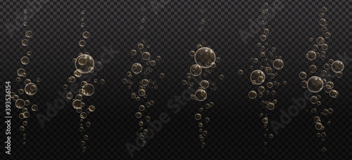 Gold fizzy bubbles. Sparkles champagne. Fizzy pop and effervescent drink. Abstract fresh soda and air bubbles, oxygen, champagne crystal. Vector illustration on black transparent background.