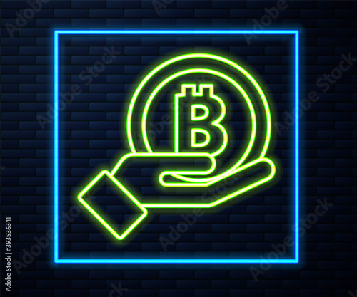 Glowing neon line Hand holding Bitcoin icon isolated on brick wall background. Blockchain technology, digital money market, cryptocoin wallet. Vector.