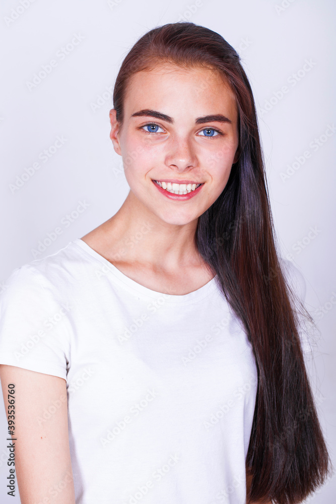 Close up portrait of a young beautiful happy brunette girl