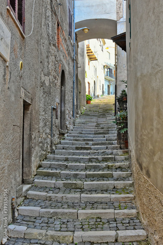 A narrow street among the old houses of Patrica, a medieval village in the Lazio region, Italy. 