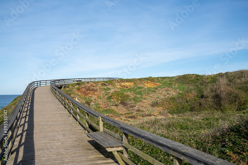 wooden boardwalk and coast at the Playa de las Catedrales national monument in Galicia