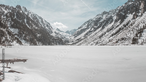 Frozen Gaube Lake (Lac de Gaube) in the French Pyrenees, in the department of the Hautes-Pyrénées, near the town of Cauterets, France. The Mount Vignemale in the background.