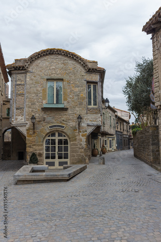 Fototapeta Naklejka Na Ścianę i Meble -  Carcassonne / France - March 15, 2020: Typical street of Carcassonne, France. One of the oldest houses in the City, half-timbered house (house with 