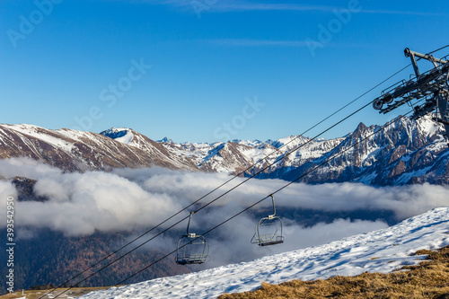 Chair ski lift station at Luchon Superbagnères Ski Resort in the Arrondissement of Saint-Gaudens, Occitania.The Luchonnais Mountains aerial view.