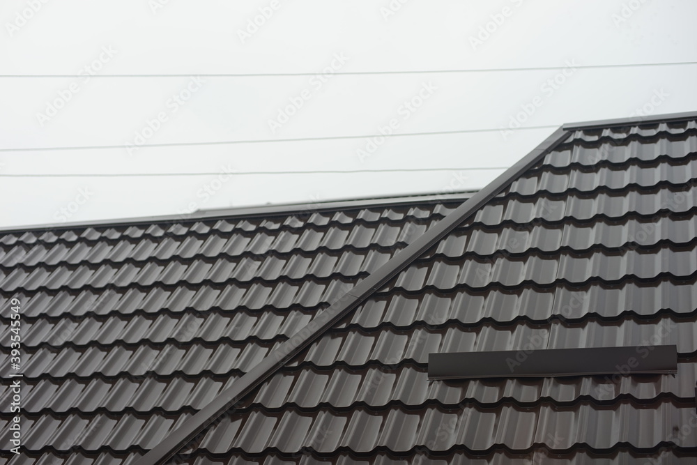 Close-up of brown tiled roof in overcast day Close-up of brown tiled roof in overcast day