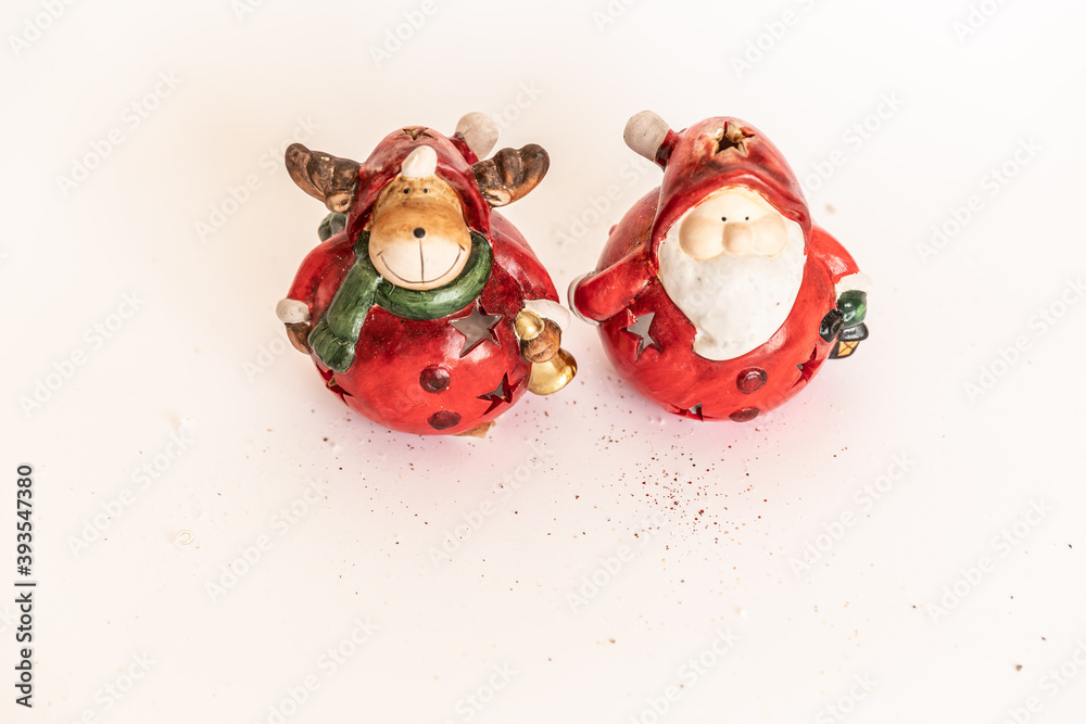 Christmas. New Year's jewelry. toy santa claus and deer on a white background.