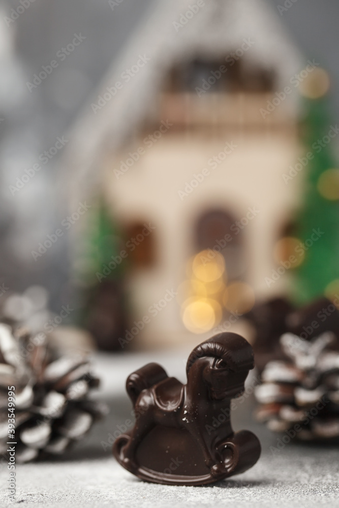 Christmas chocolates. Chocolate figurines-Santa Claus, hare, horse, dragon, bell