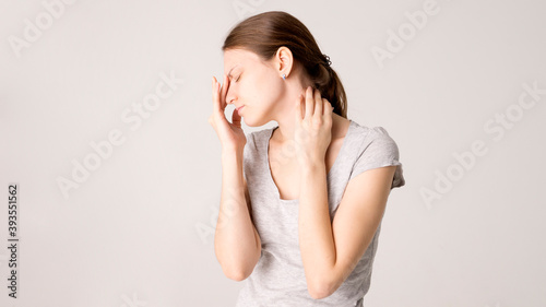 Young beautiful woman has headache