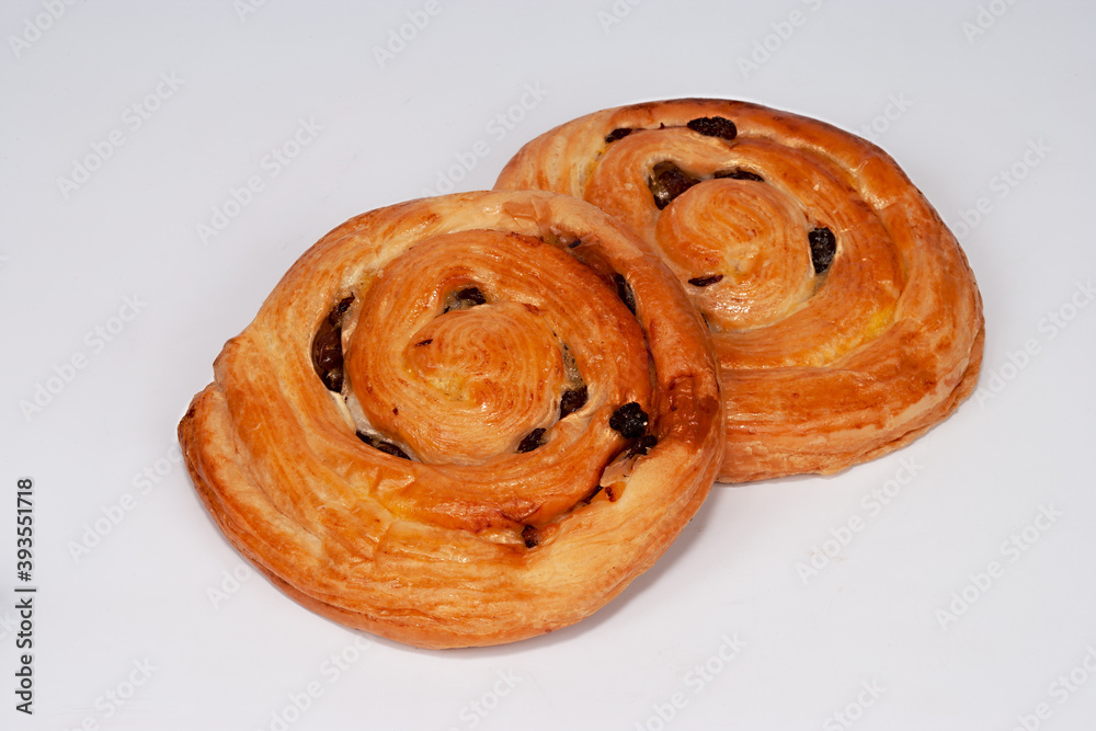 Fototapeta premium buns with raisins on a white background