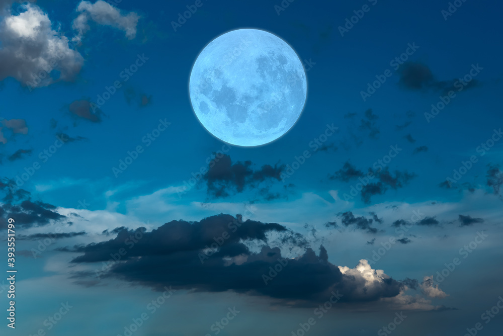 Full moon on the blue sky.	