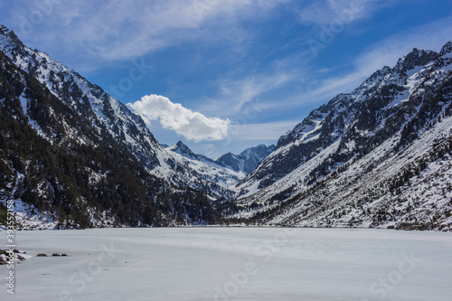 Frozen Gaube Lake (Lac de Gaube) in the French Pyrenees, in the department of the Hautes-Pyrénées, near the town of Cauterets, France. The Mount Vignemale in the background.
