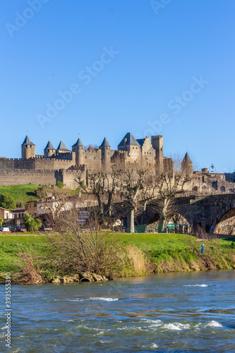 The River Aude and Old Bridge (Pont Vieux, 14th Cent) leading to Medieval town of Carcassonne (Cité), Languedoc-Roussillon, France.