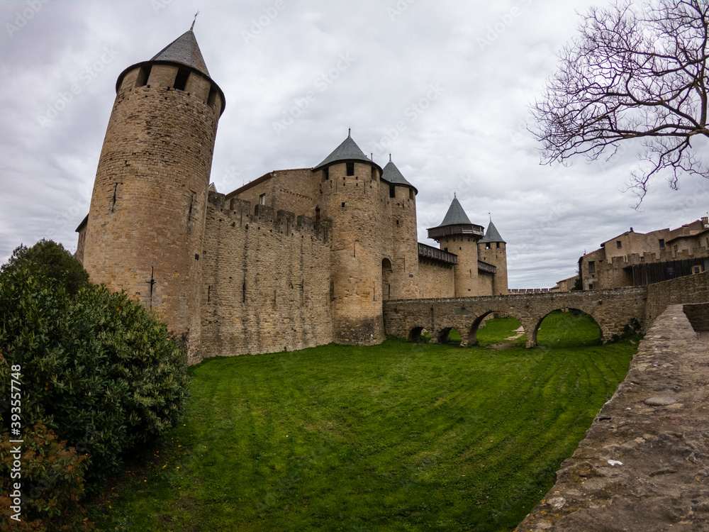 The Château Comtal - entrance from the Cité of Carcassonne, France. The chateau of the Counts of Carcassonne and the ramparts, a UNESCO World Heritage site located at the heart of the fortified city.