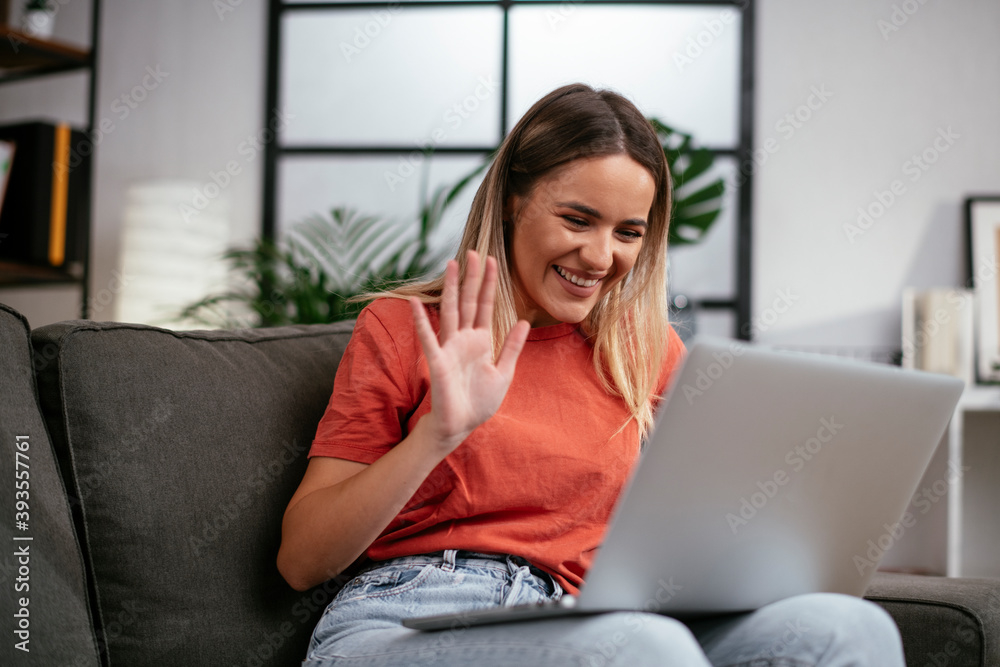 Young woman having video call. Beautiful woman enjoying at home. Young woman having video call. Beautiful woman enjoying at home.