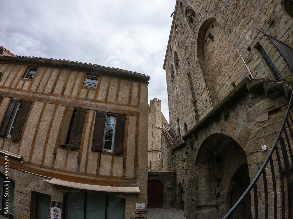 Carcassonne / France - March 15, 2020: Fortifications of the medieval city of Carcassonne. The Narbonnaise gate, was built around 1280 during the reign of Philip III. Carcassonne / France - March 15, 2020: Fortifications of the medieval city of Carcassonne. The Narbonnaise gate, was built around 1280 during the reign of Philip III.
