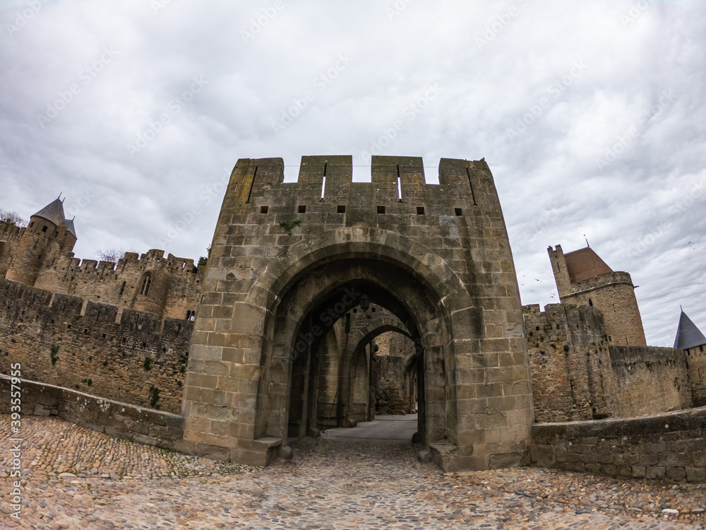 Fortifications of the medieval city of Carcassonne, France. The Narbonnaise gate, was built around 1280 during the reign of Philip III the Bold and was made up of two enormous spur towers.