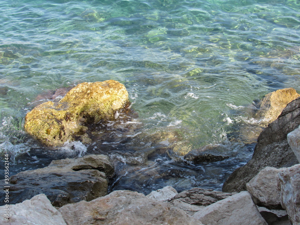 Obraz premium Beautiful view of stones underwater on the Mediterranean seaside