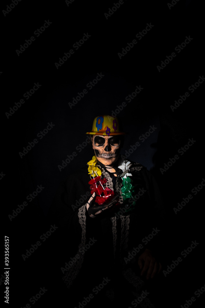 The death. Artistic makeup representing death in a carnival costume play, Low Key image, selective focus.